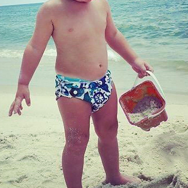 child wearing reusable swim diaper anchor