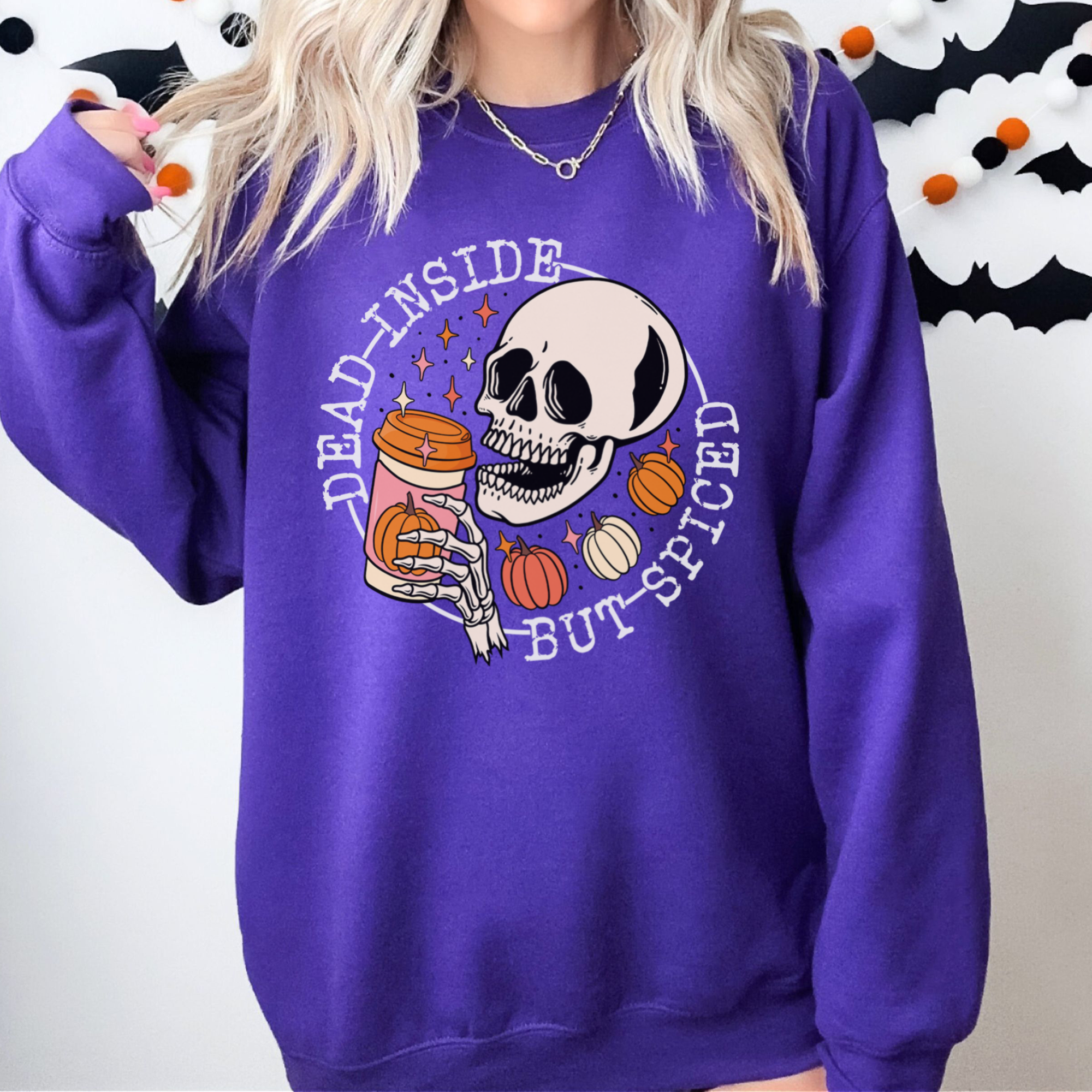 Halloween Sweatshirt with a skeleton sipping a seasonal drink. all SKUs