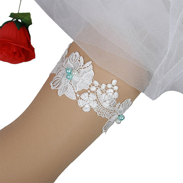 ivory and sky blue pearls garter on prop