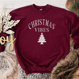 Flat lay image of maroon Christmas Vibes Sweatshirt with white glitter letting. all SKUs