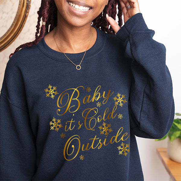 Navy Blue Baby It's Cold Outside Sweatshirt with Glossy Goldy Lettering.  These Christmas Sweatshirts are available in sizes XS to 5XL. all SKUs