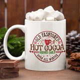 Old fashioned hot cocoa mug with Christmas graphic design that includes candy cane, gingerbread man and peppermint candy.