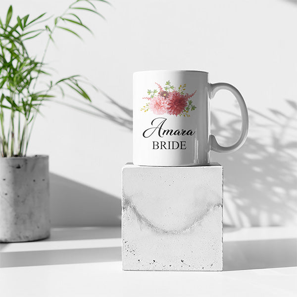 Beautiful personalized bride ceramic mug with elegant floral bouquet.  These ceramic mugs can be customized with any name, title and date for a personal touch. all SKUs