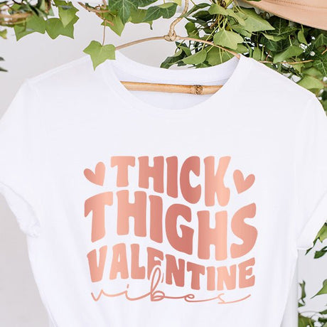 Shop our Thick Thighs Valentine Vibes tops that are available as a tshirt, crop top, crop hoodie, long sleeve tee, sweatshirt or hoodie.  We offer several colors and sizes from XS to 6XL. all SKUs