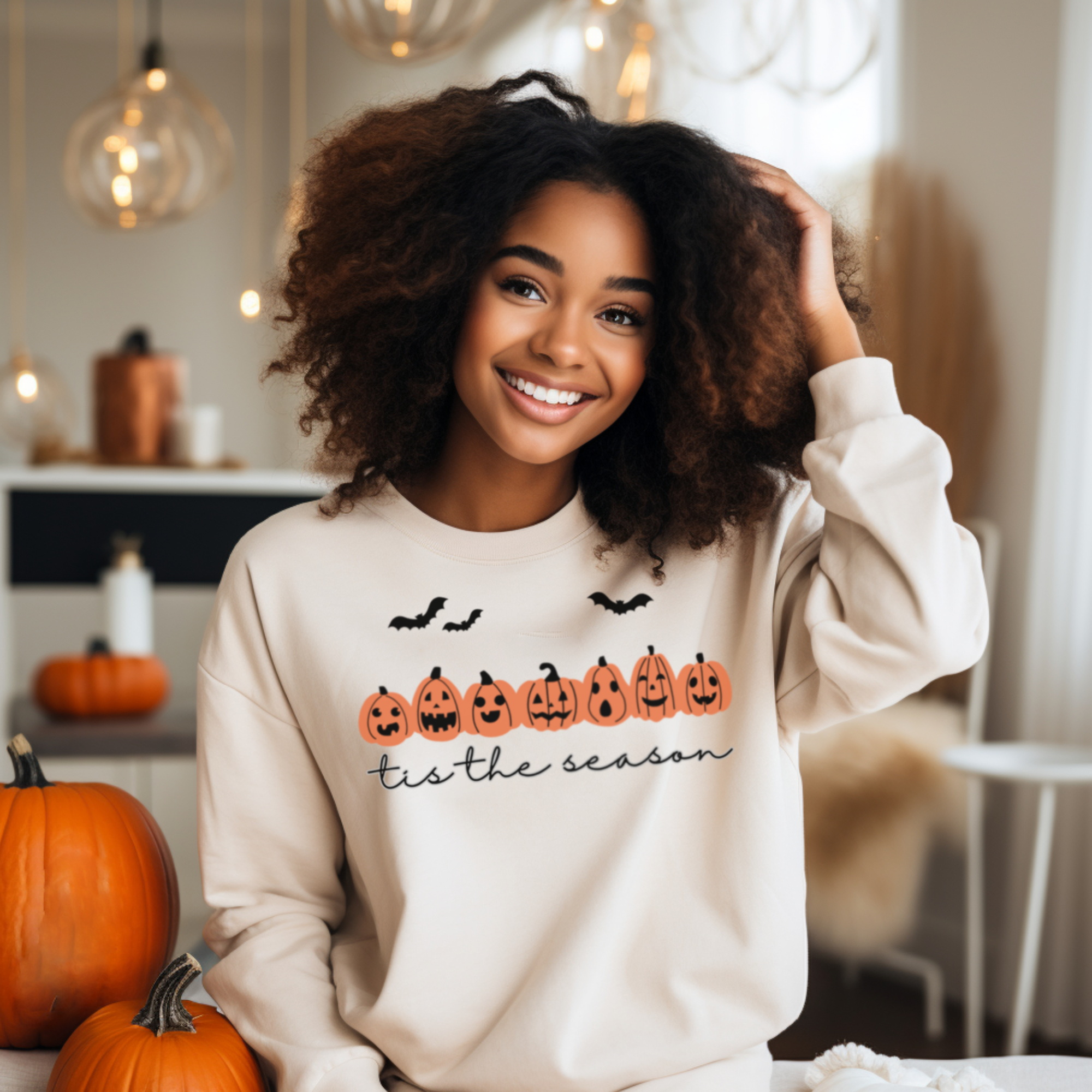 A funny Halloween Sweatshirt featuring various pumpkin carve faces and the words Tis the Season. allSKUs