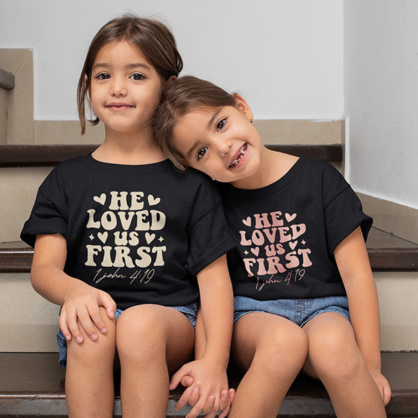 He love us first Christian Shirt with a great message.  Choose from various styles including crewnecks, v-necks, tank tops, hoodies, sweatshirts, long sleeved tees and more. all SKUs