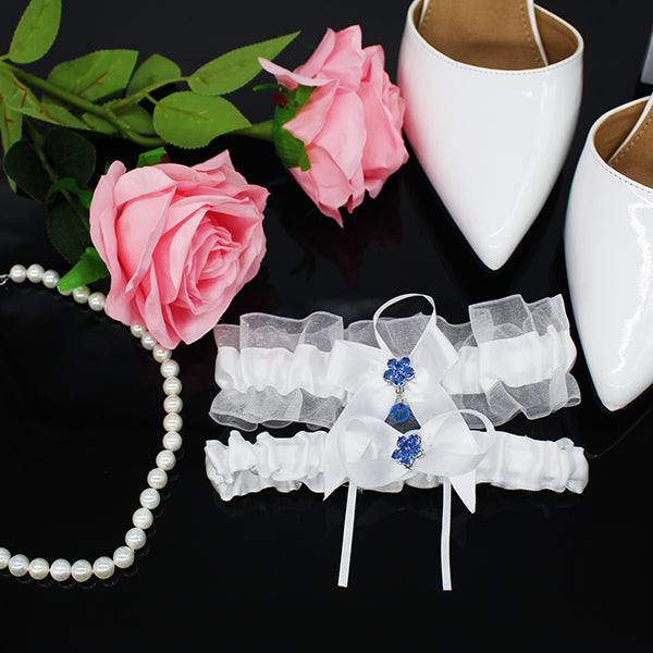 white wedding garter set with flower charm lifestyle 2