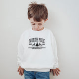 Little boy wearing our North Pole University sweatshirt.  all SKUs
